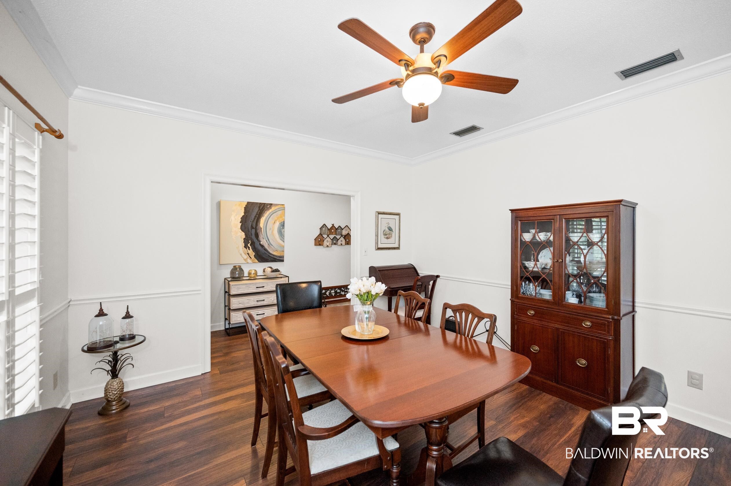 6638 Jackson Square Daphne, AL 36526 - Photo 19 of 62 Dining room featuring dark hardwood / wood-style floors, crown molding, and ceiling fan
