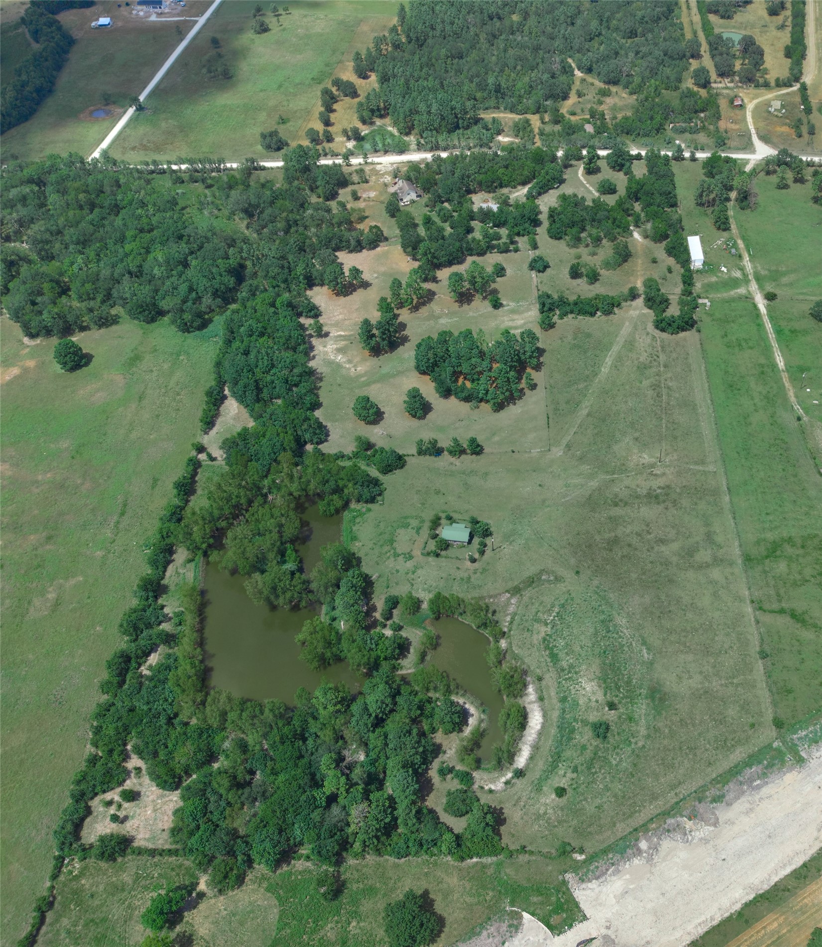 -tbd Davis Road Huntsville, TX 77340 - Photo 4 of 10 From above, the property offers a scenic mix of open space and established trees throughout the grounds.