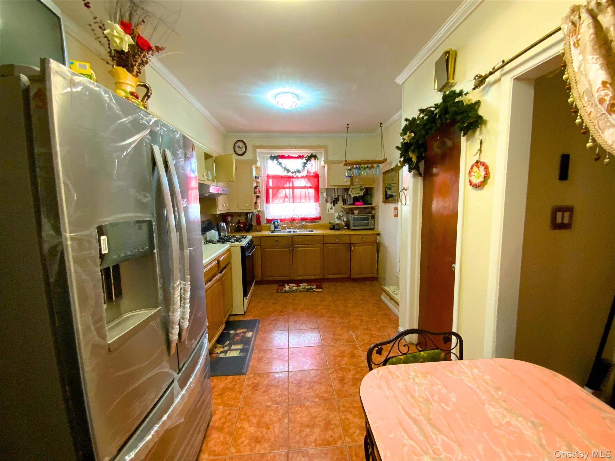 552 Beach 68th Street Queens, NY 11692 - Photo 15 of 34 a bathroom with double vanity and a shower
