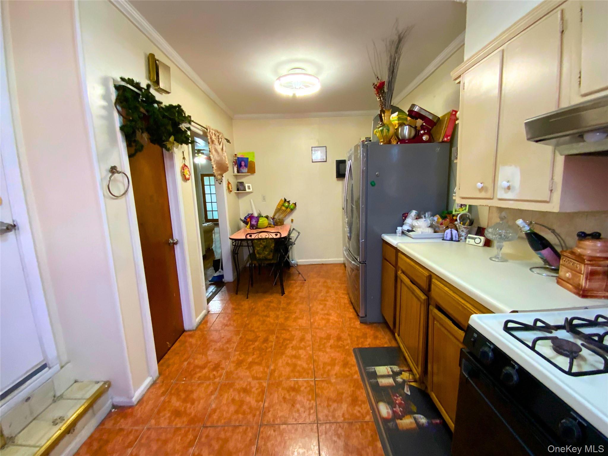 552 Beach 68th Street Queens, NY 11692 - Photo 16 of 34 a bed room with a bed and a couch