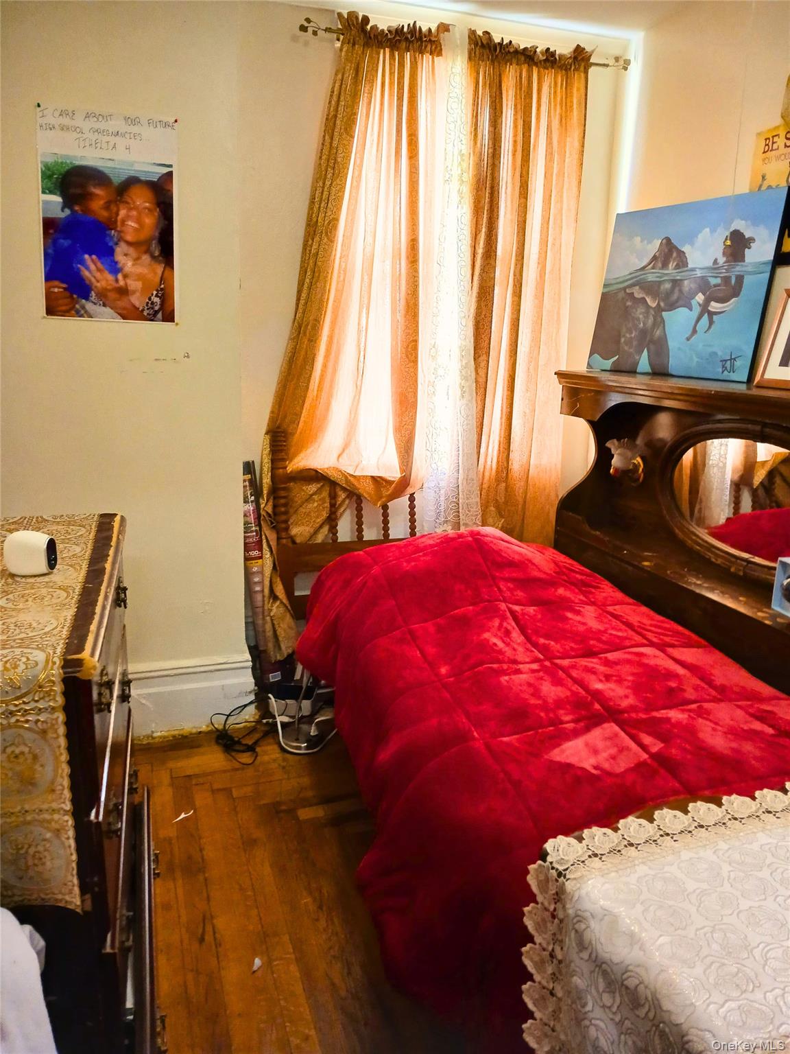 552 Beach 68th Street Queens, NY 11692 - Photo 18 of 34 a bedroom with a bed and wooden floor