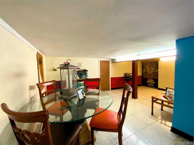 a kitchen with granite countertop a refrigerator a stove and a sink