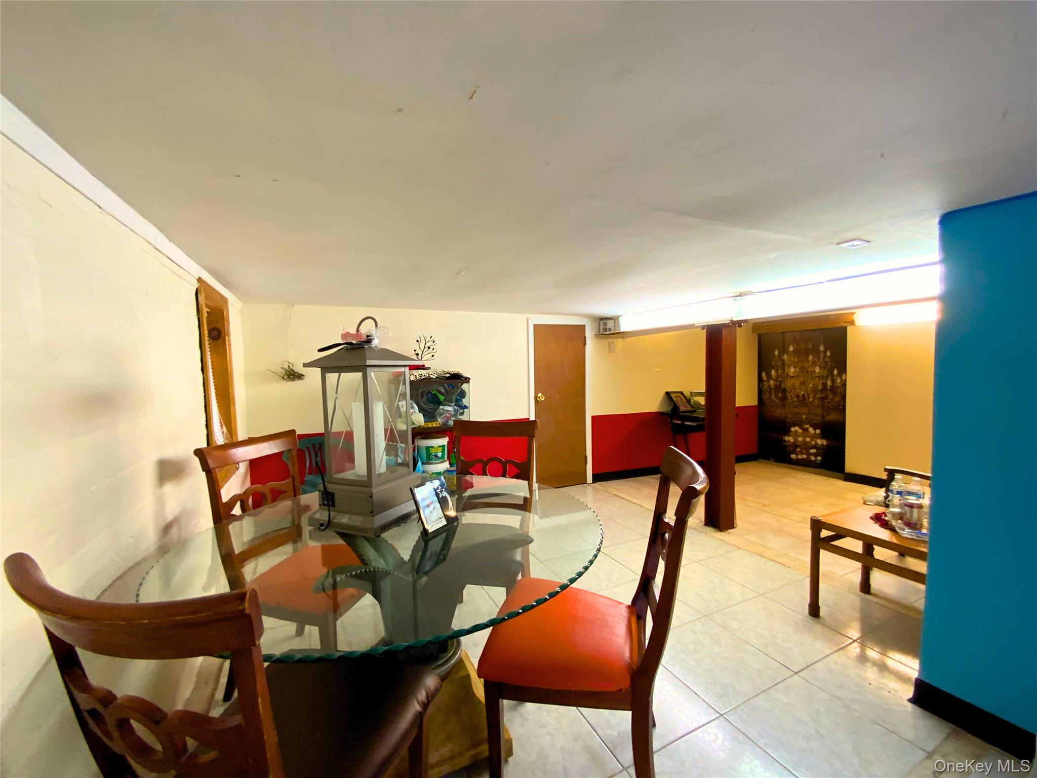 552 Beach 68th Street Queens, NY 11692 - Photo 21 of 34 a dining room with furniture and a livingroom