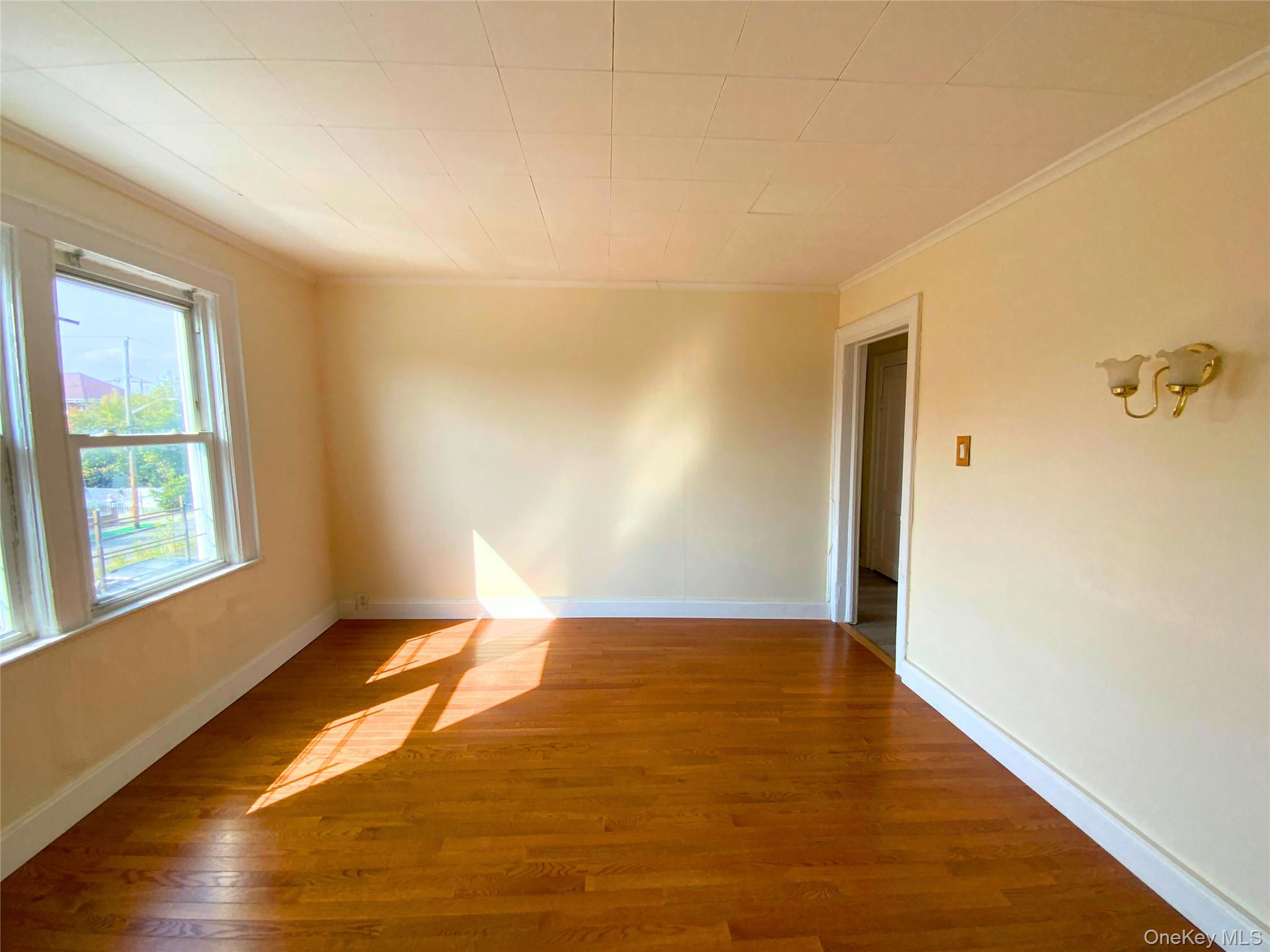 552 Beach 68th Street Queens, NY 11692 - Photo 29 of 34 a view of an empty room and window