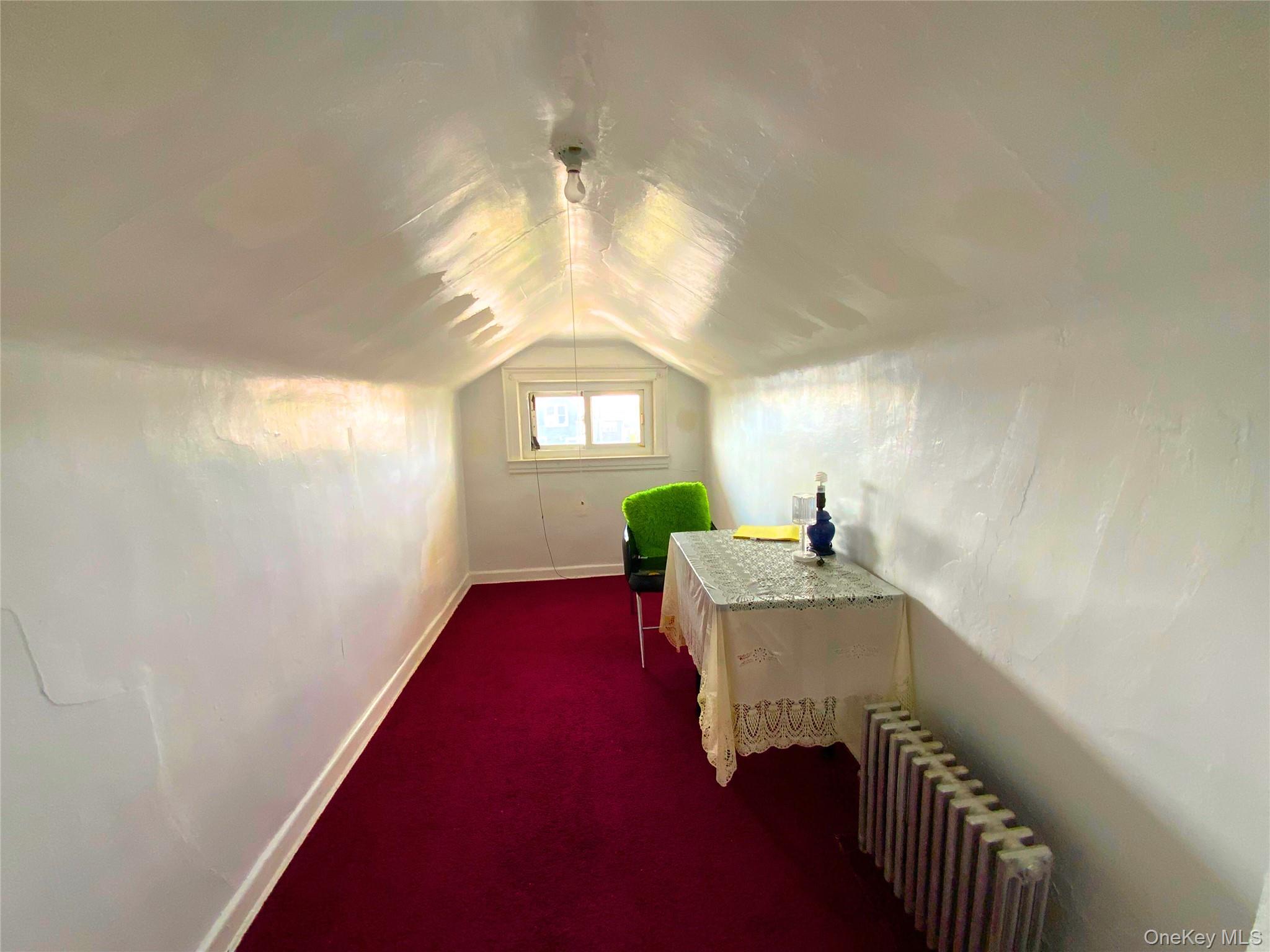 552 Beach 68th Street Queens, NY 11692 - Photo 33 of 34 a workspace with furniture and a chandelier