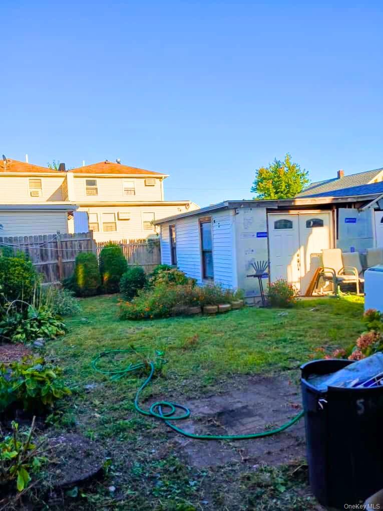 552 Beach 68th Street Queens, NY 11692 - Photo 6 of 34 a view of a house with backyard and a garden