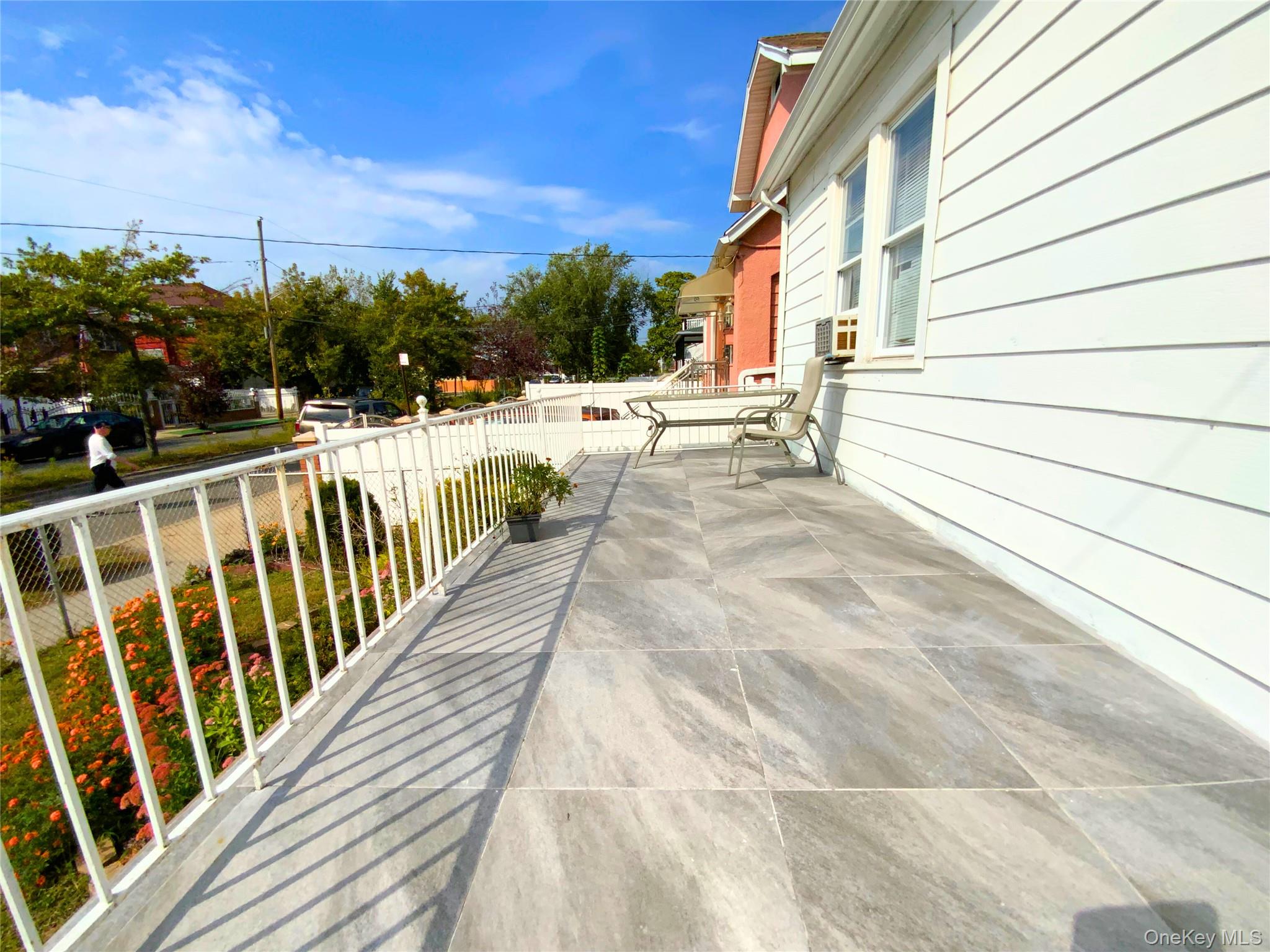 552 Beach 68th Street Queens, NY 11692 - Photo 7 of 34 a view of balcony with wooden floor and seating space