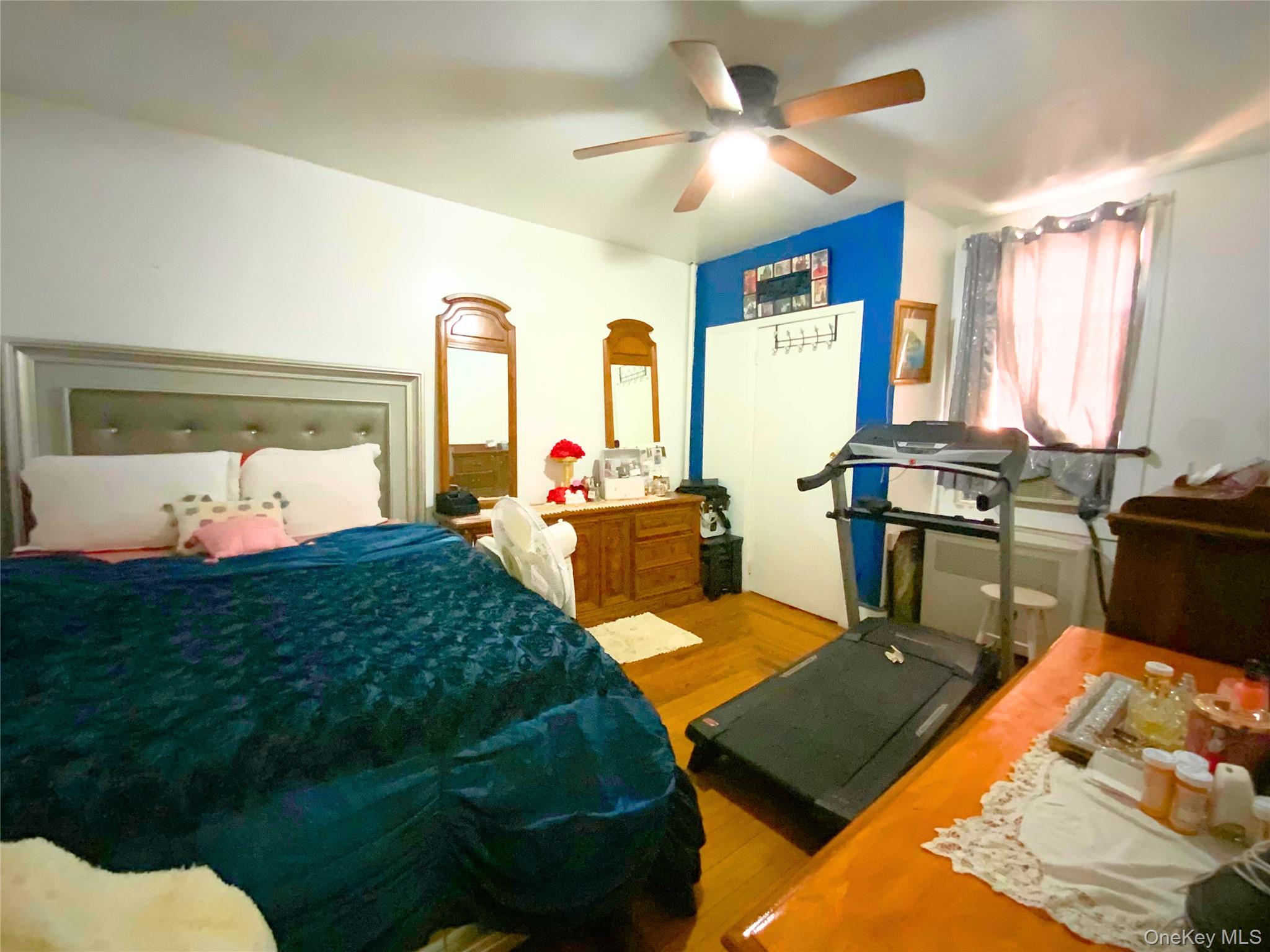 552 Beach 68th Street Queens, NY 11692 - Photo 10 of 34 a bed room with a bed furniture and a window