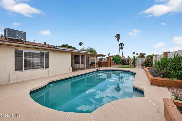 a view of a house with swimming pool