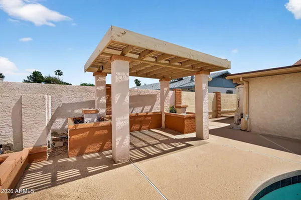 a patio with table and chairs