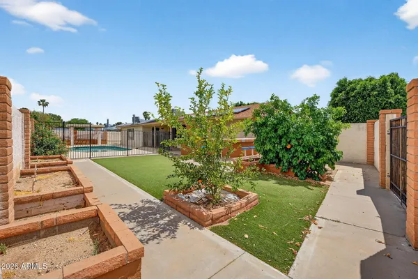 a view of a yard and front view of a house