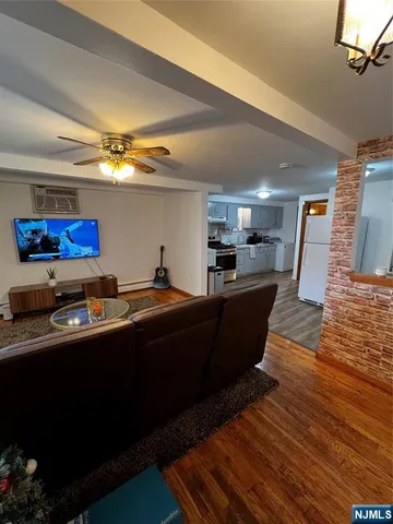 a kitchen with stainless steel appliances kitchen island granite countertop a sink a counter space and cabinets