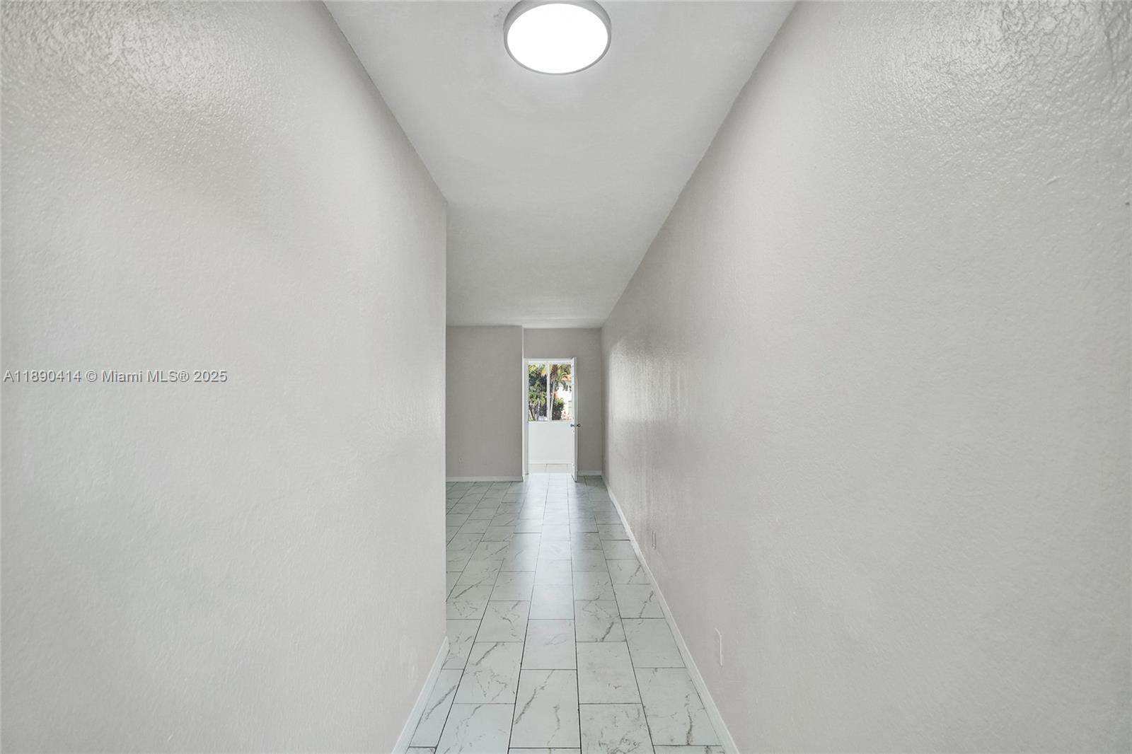 1945 Calais Drive, Unit 9 Miami Beach, FL 33141 - Photo 11 of 47 a view of a hallway