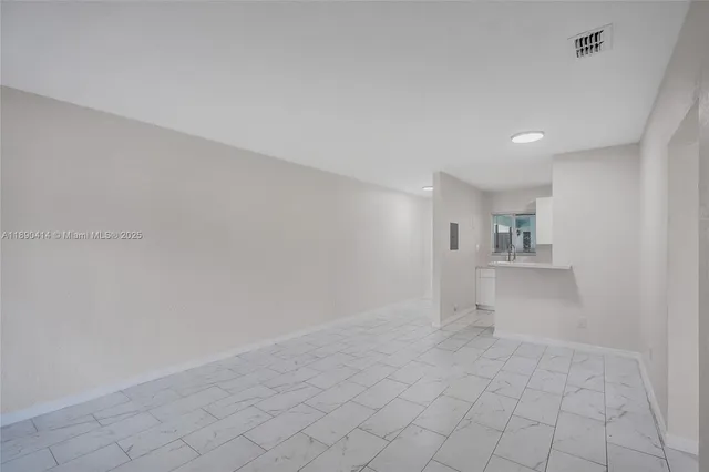 a kitchen with a stove and a microwave