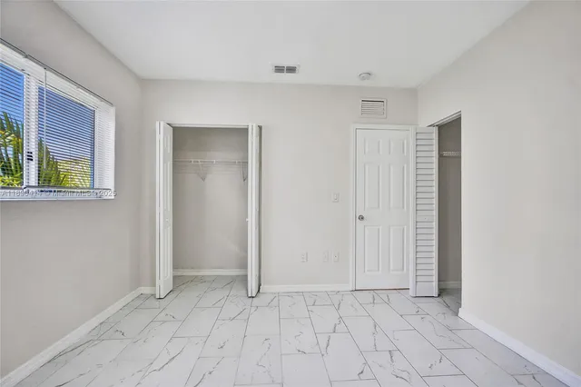 a view of a room with a large window