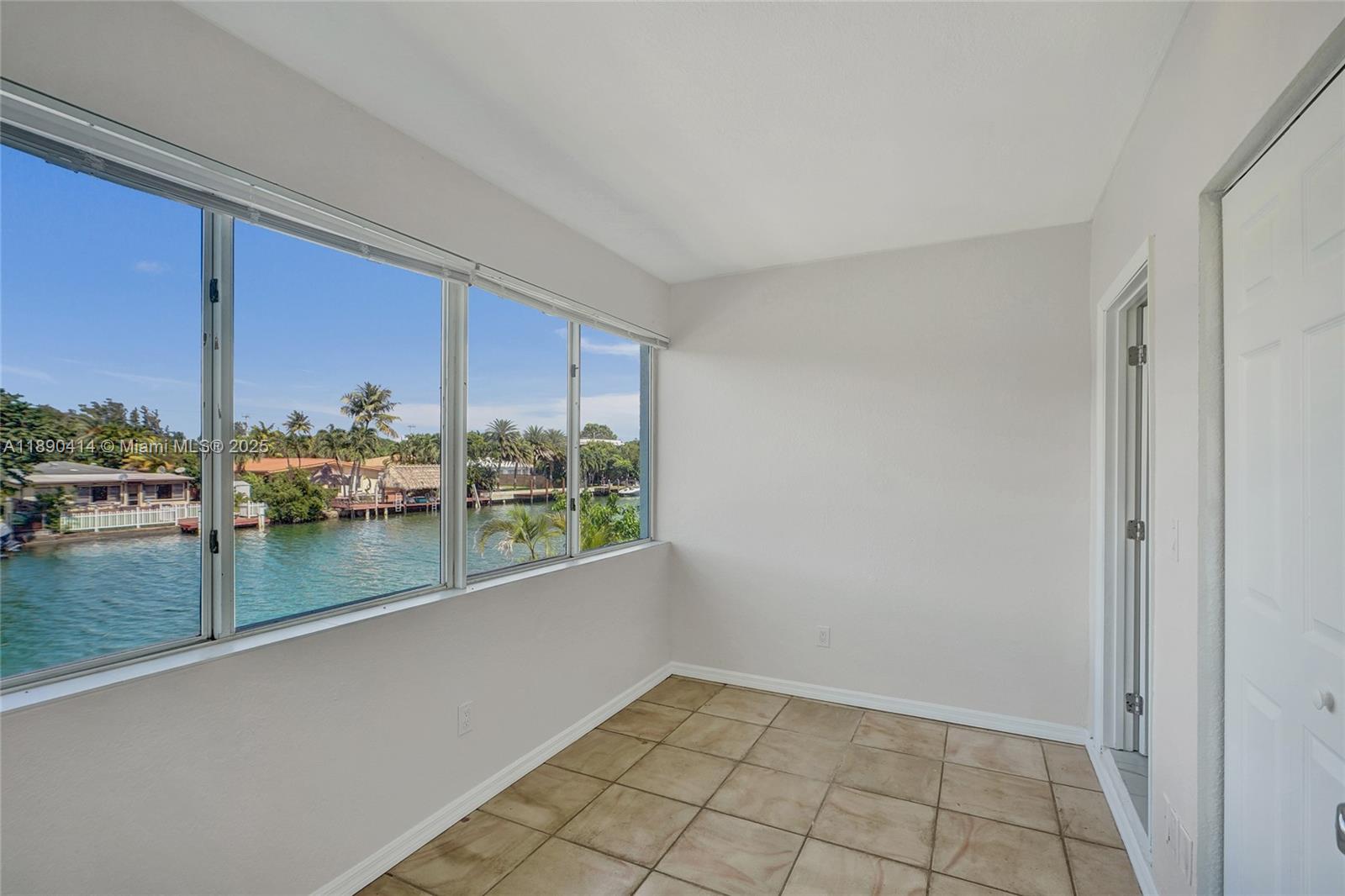 1945 Calais Drive, Unit 9 Miami Beach, FL 33141 - Photo 41 of 47 a view of a lake from a window