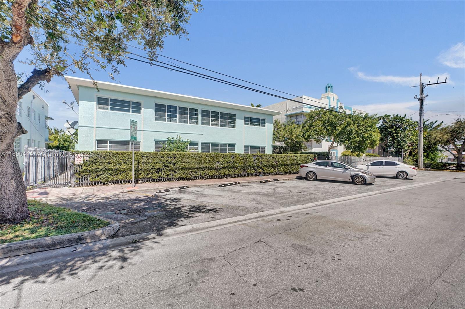 1945 Calais Drive, Unit 9 Miami Beach, FL 33141 - Photo 7 of 47 a view of a parked cars in front of a house