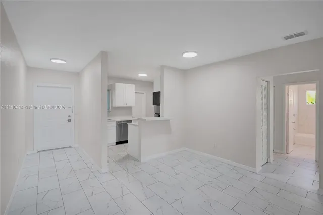 a view of an empty room and window