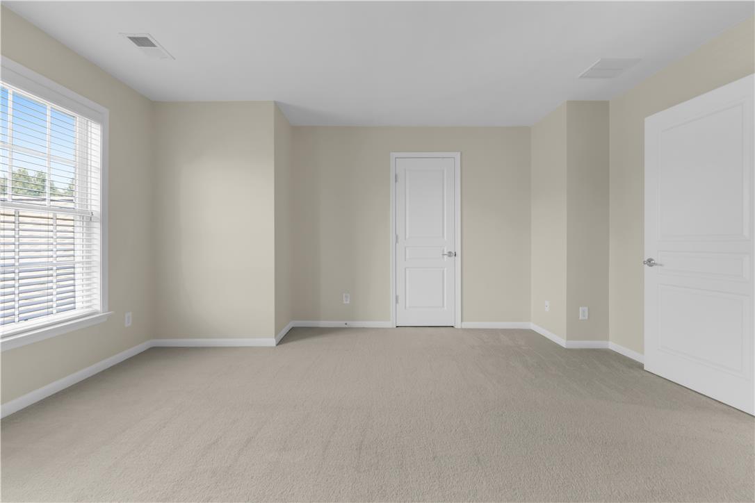 1709 Travers Road Breinigsville, PA 18031 - Photo 42 of 55 An inviting room awaits your personal touch, featuring fresh carpet and ample natural light.