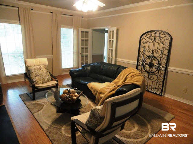 519 West Bay Bluff Daphne, AL 36526 - Photo 10 of 25 Family Room with Fireplace and Wood Flooring