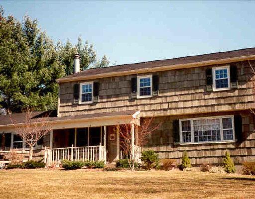 24 Quaker Ridge Road Bethel, CT 06801 - Photo 1 of 1 a front view of a house with a yard