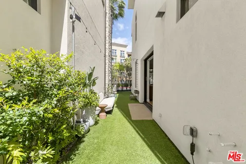 a view of a living room and a balcony