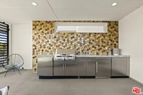 a bathroom with a granite countertop sink a mirror and a shower