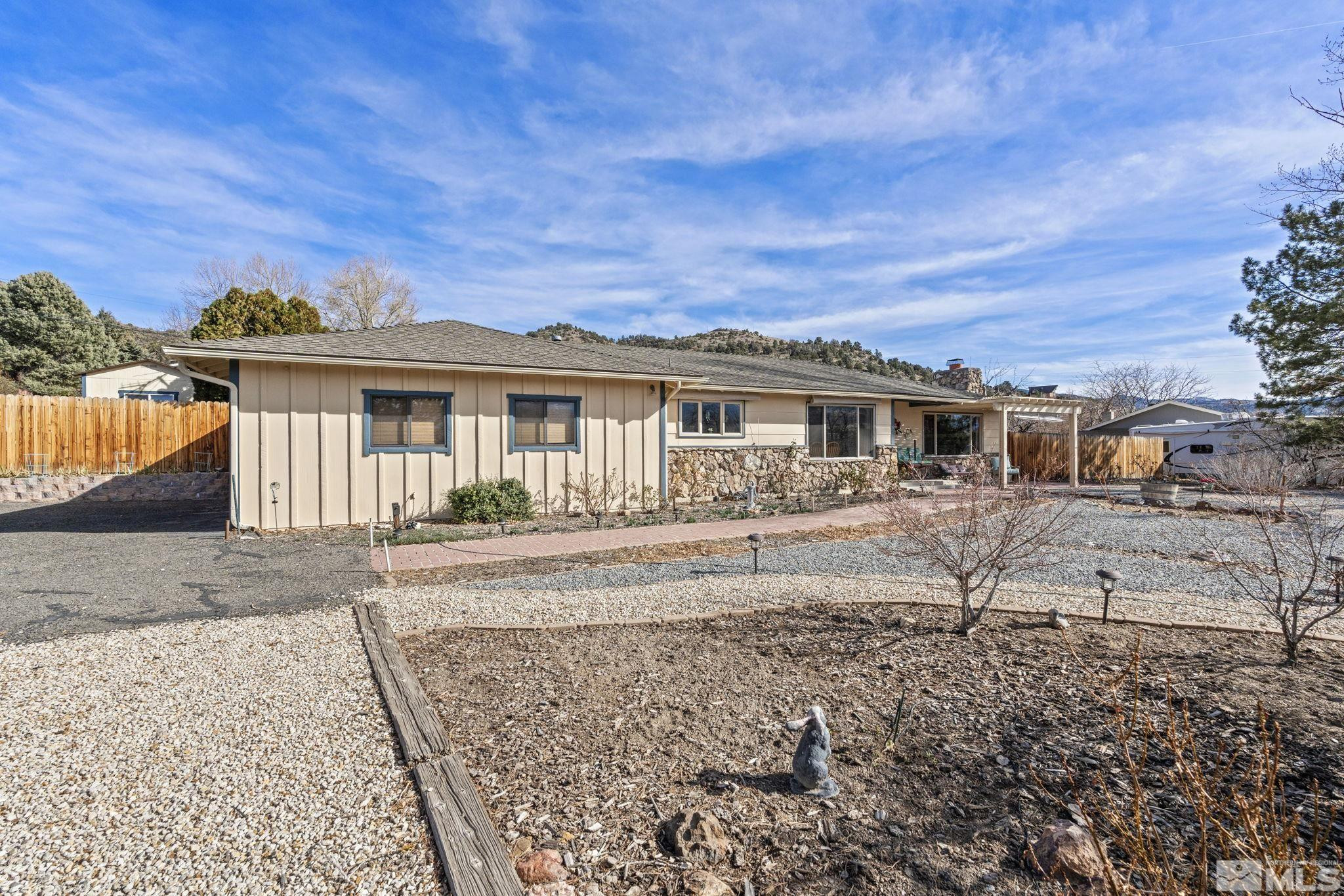 14440 Rim Rock Drive Reno, NV 89521 - Photo 1 of 39 front view of a house with a yard