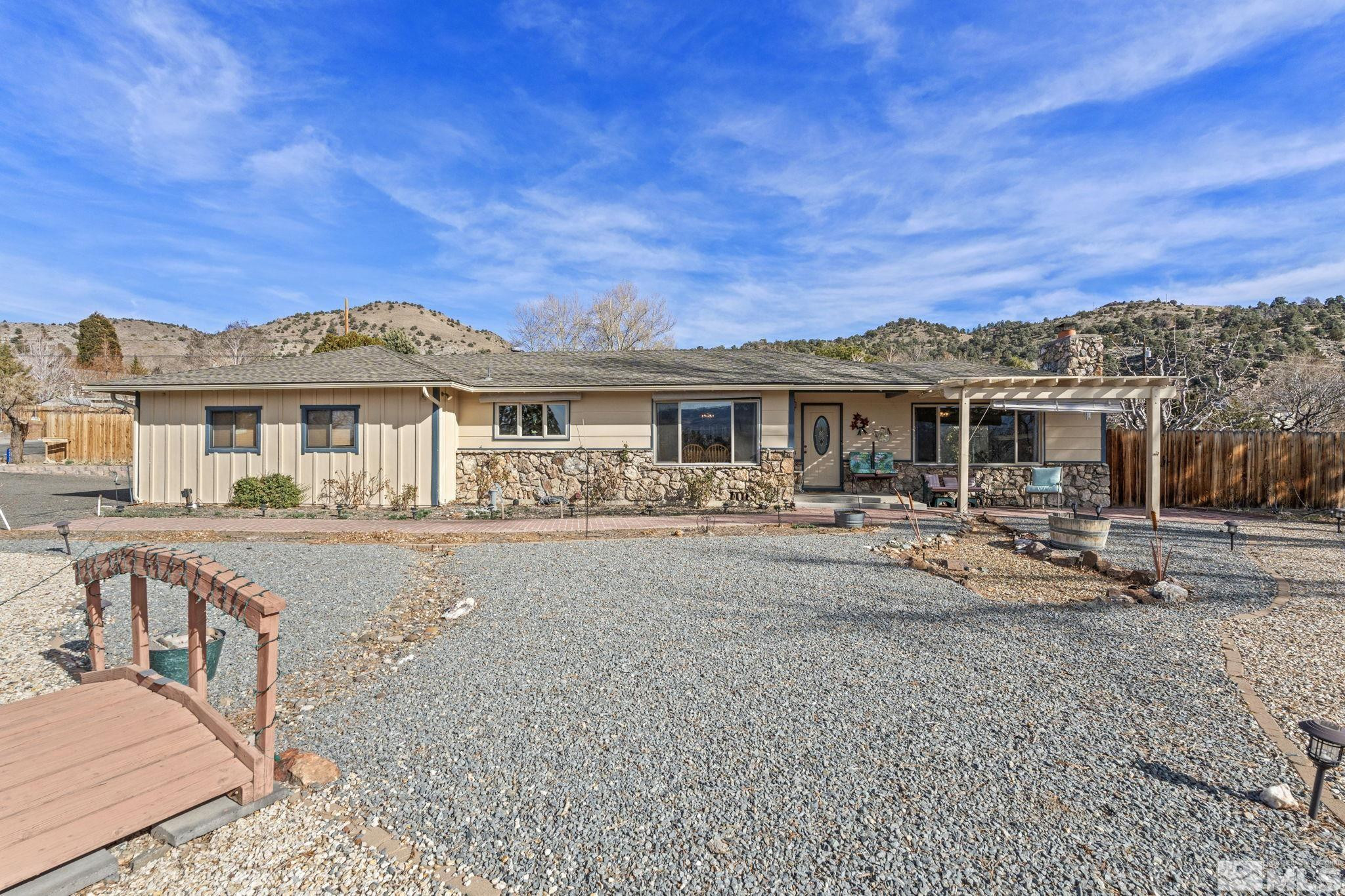 14440 Rim Rock Drive Reno, NV 89521 - Photo 2 of 39 a view of a house with a patio