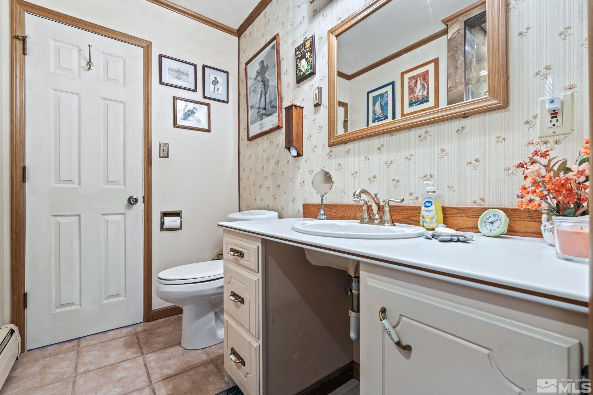 14440 Rim Rock Drive Reno, NV 89521 - Photo 26 of 39 a bathroom with a sink a toilet and shower