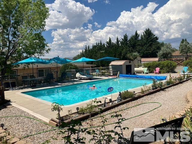 14440 Rim Rock Drive Reno, NV 89521 - Photo 3 of 39 a view of a swimming pool with a patio