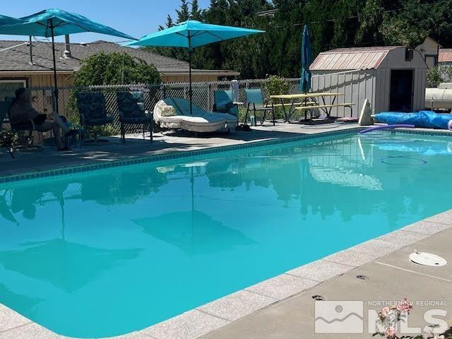 14440 Rim Rock Drive Reno, NV 89521 - Photo 34 of 39 swimming pool view with a seating space