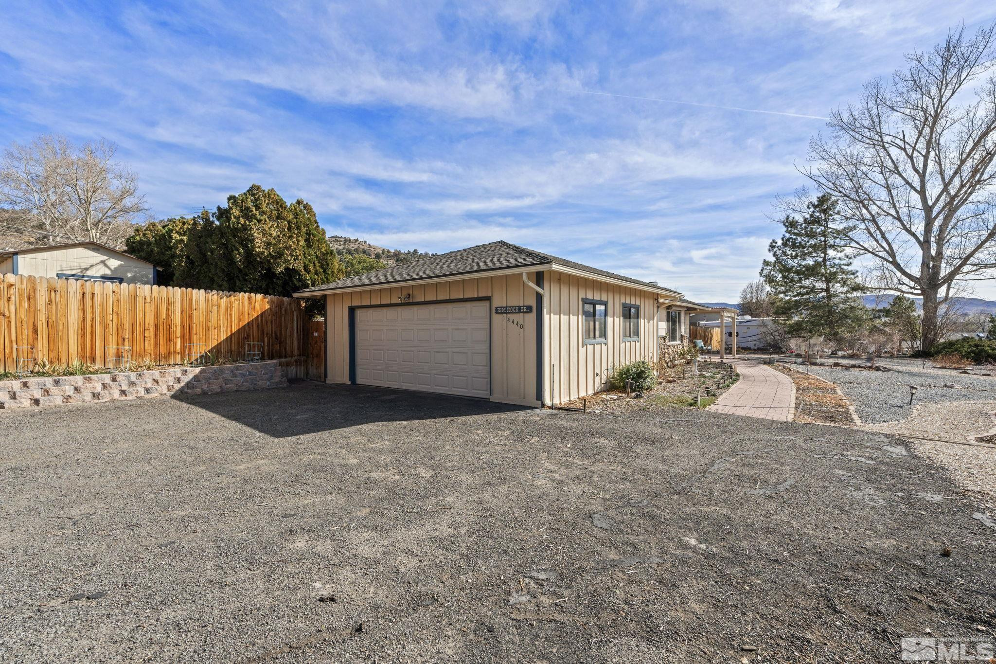 14440 Rim Rock Drive Reno, NV 89521 - Photo 8 of 39 a view of a house with a outdoor space