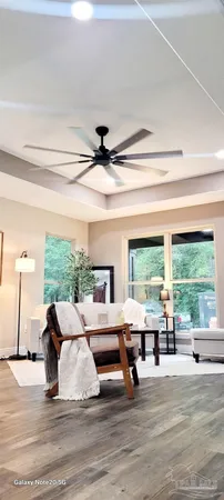 a bathroom with a granite countertop sink and mirror