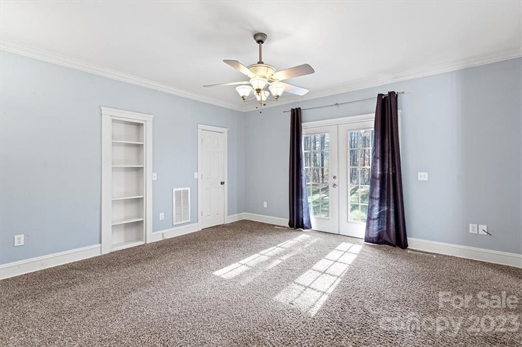 7275 Davidson Highway Concord, NC 28027 - Photo 13 of 47 a view of a chandelier fan and entryway