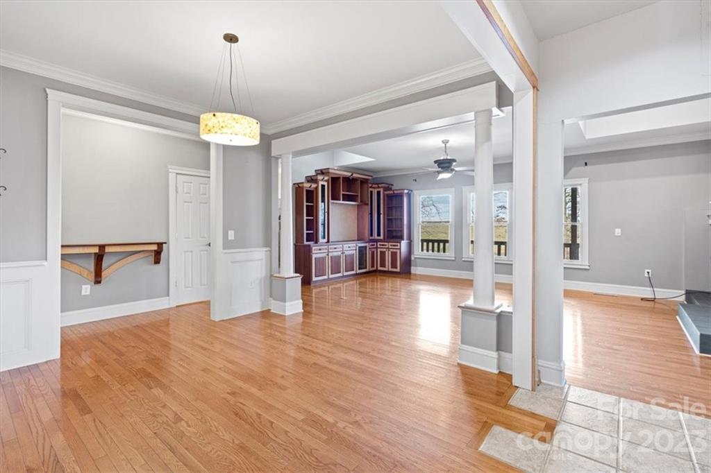 7275 Davidson Highway Concord, NC 28027 - Photo 32 of 47 a view of a hallway with wooden floor and a kitchen
