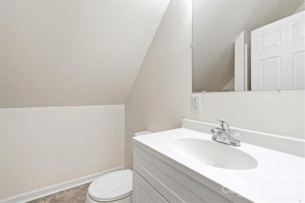 7275 Davidson Highway Concord, NC 28027 - Photo 40 of 47 a bathroom with a sink toilet and mirror