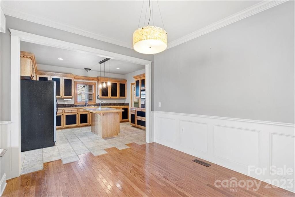 7275 Davidson Highway Concord, NC 28027 - Photo 4 of 47 a view of a kitchen with a sink and wooden floor