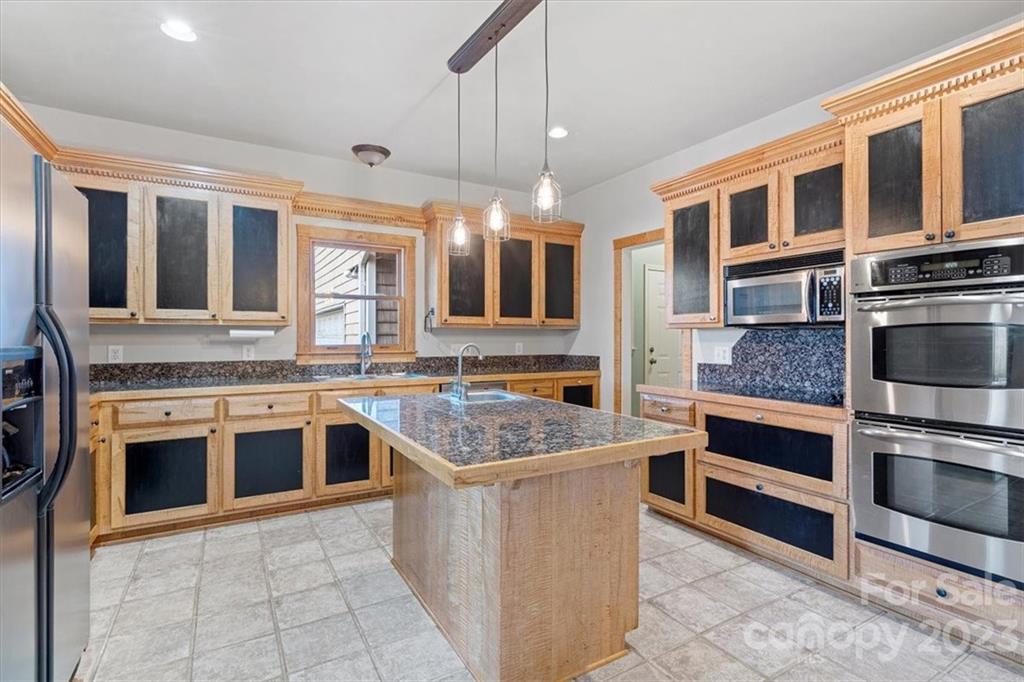 7275 Davidson Highway Concord, NC 28027 - Photo 5 of 47 a kitchen with stainless steel appliances granite countertop a stove and cabinets