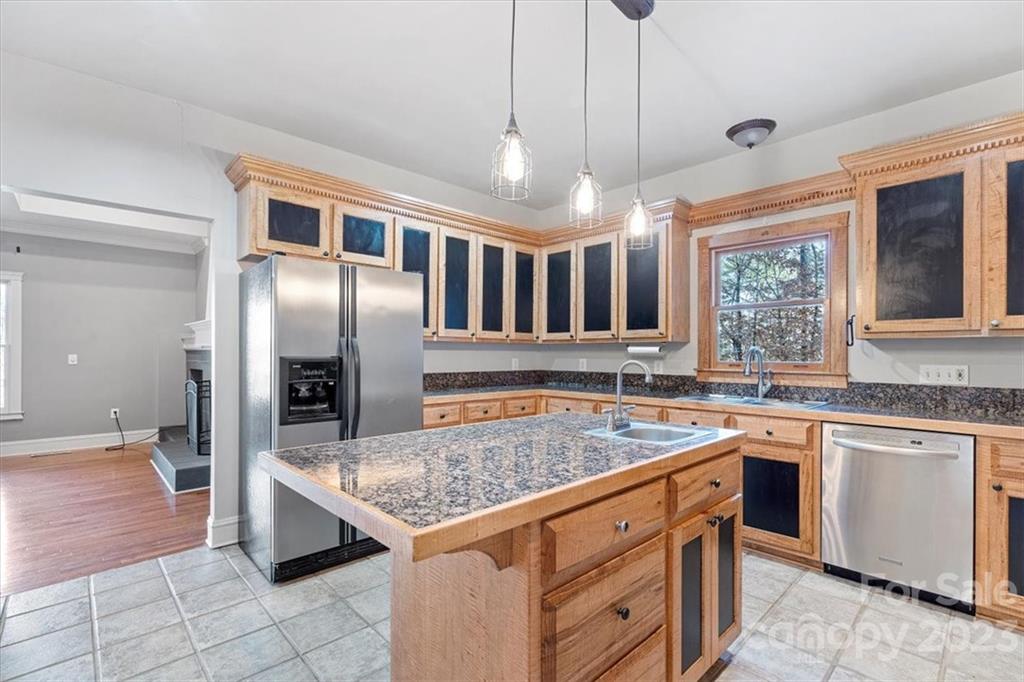 7275 Davidson Highway Concord, NC 28027 - Photo 7 of 47 a kitchen with stainless steel appliances granite countertop a sink a stove and a refrigerator