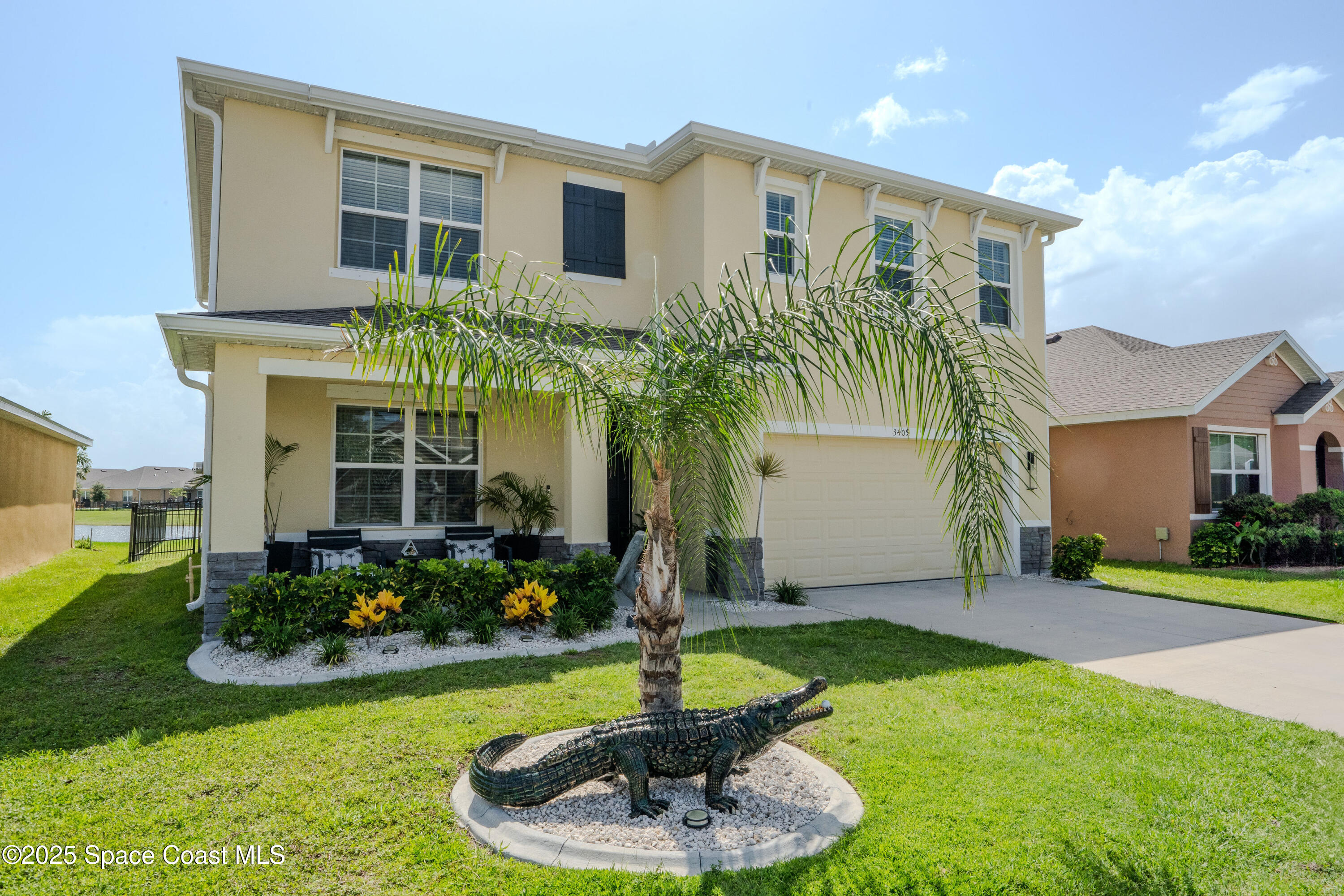 3409 Burrowing Owl Mims, FL 32754 - Photo 1 of 36 a front view of house with yard and green space