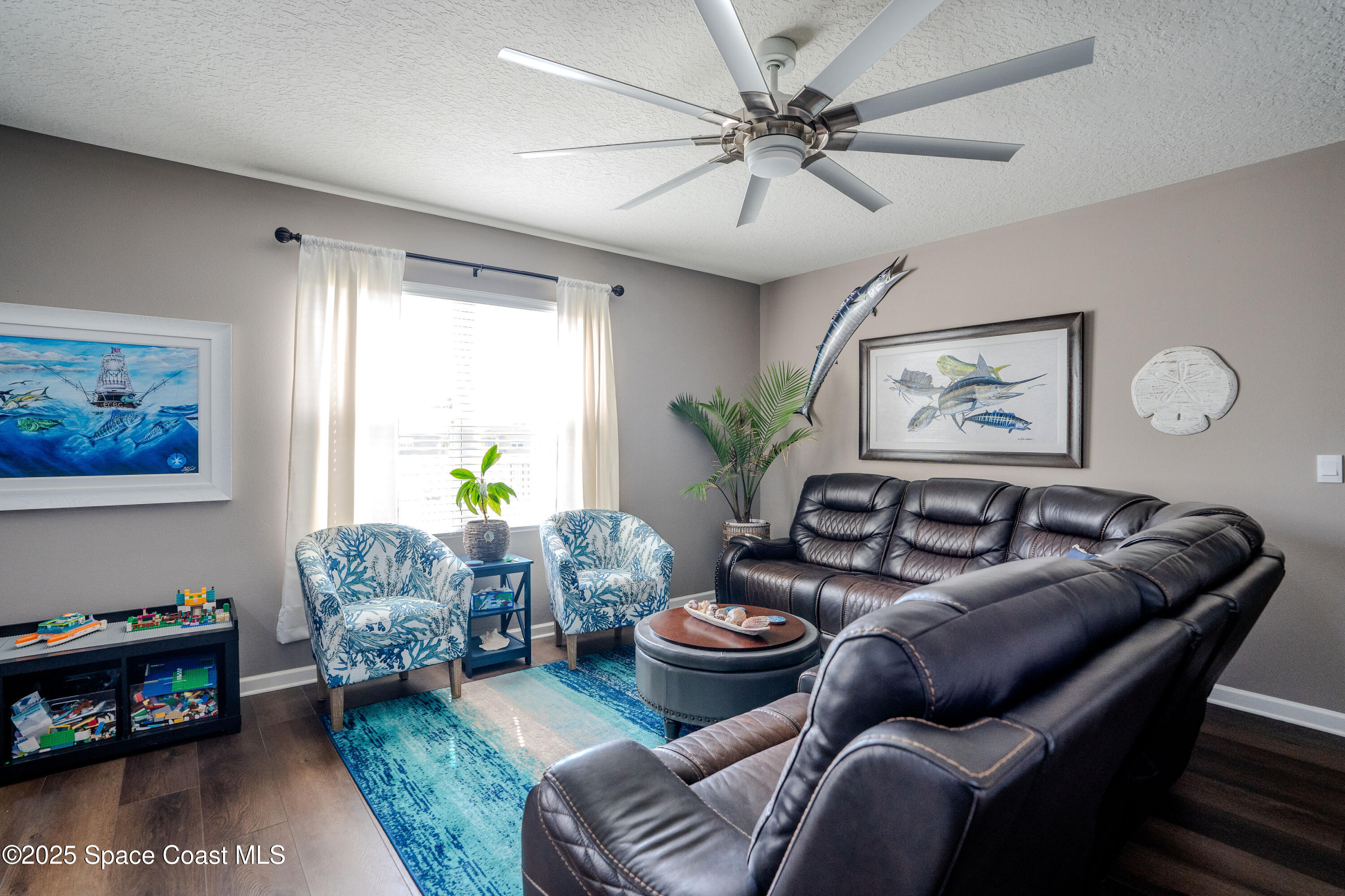 3409 Burrowing Owl Mims, FL 32754 - Photo 14 of 36 a living room with furniture and a fireplace