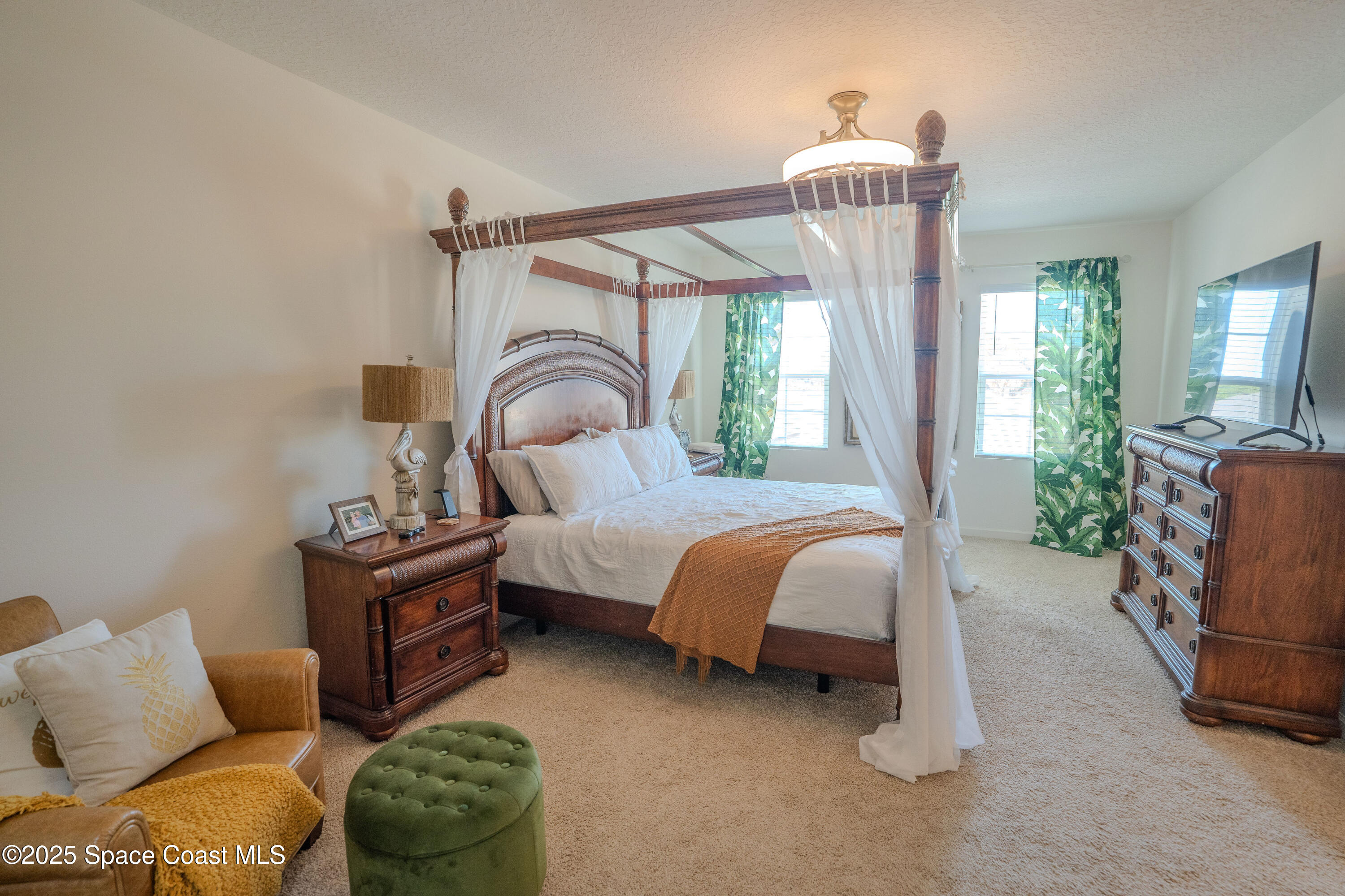 3409 Burrowing Owl Mims, FL 32754 - Photo 18 of 36 a bedroom with bed and balcony