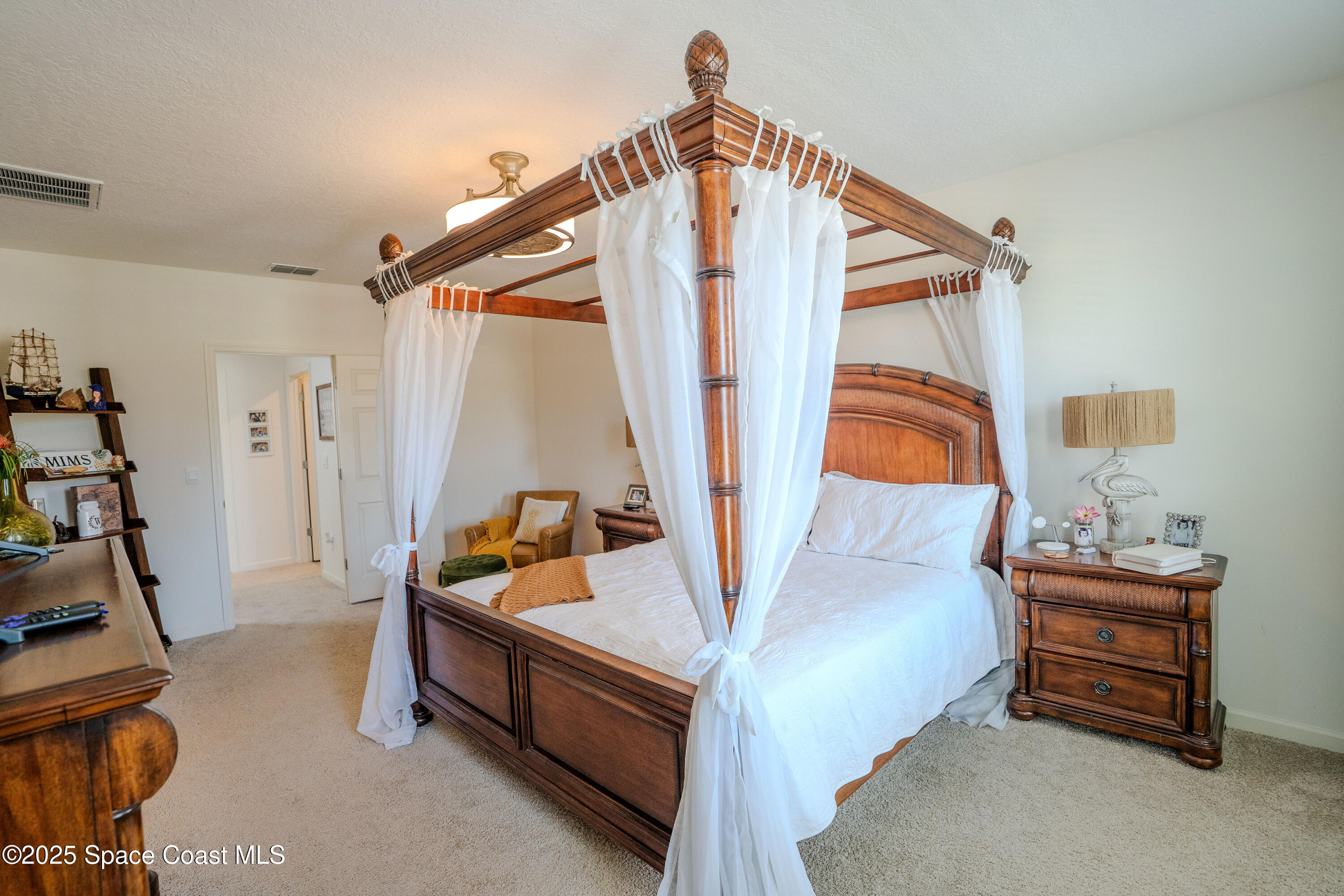 3409 Burrowing Owl Mims, FL 32754 - Photo 19 of 36 a living room with furniture a rug and a window