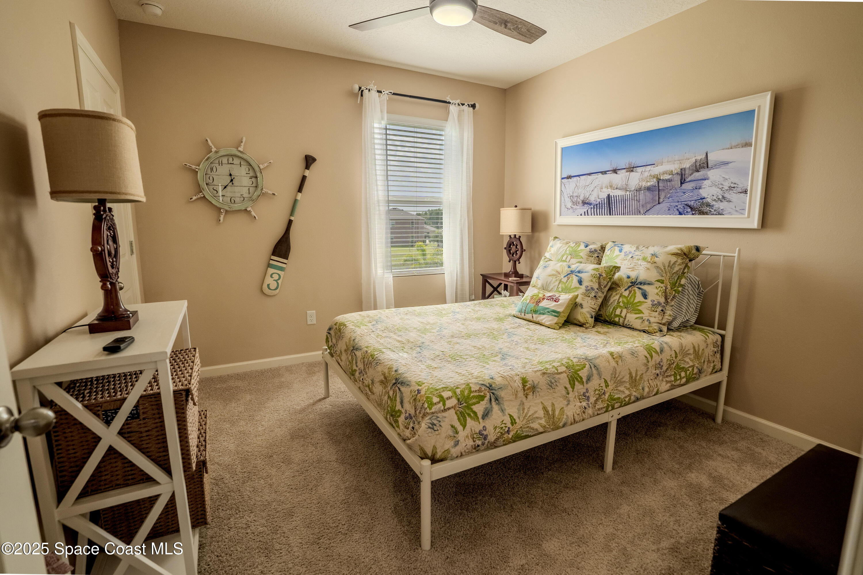 3409 Burrowing Owl Mims, FL 32754 - Photo 22 of 36 a bedroom with a bed and a window