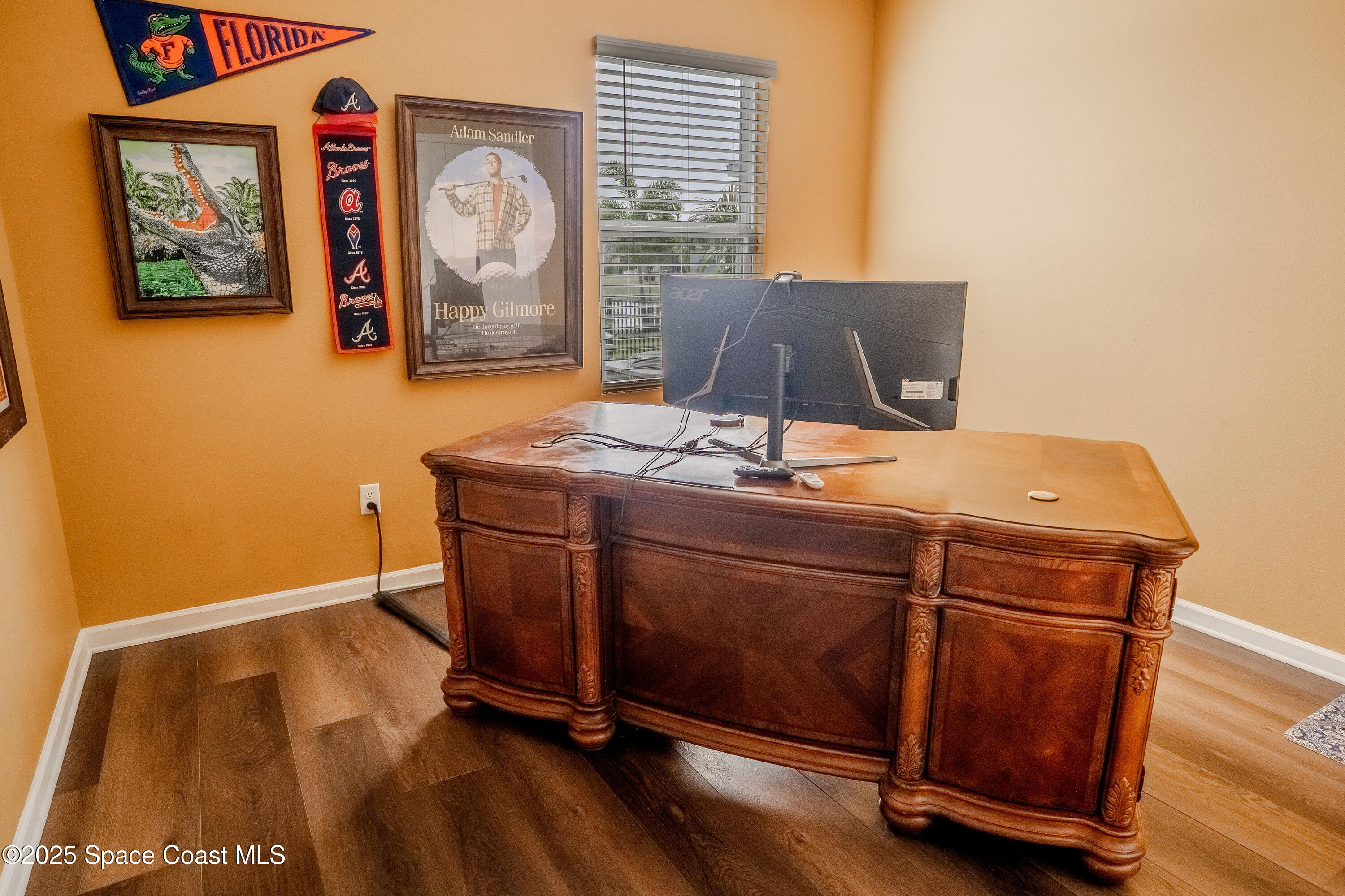 3409 Burrowing Owl Mims, FL 32754 - Photo 25 of 36 a room with a window and wooden floor