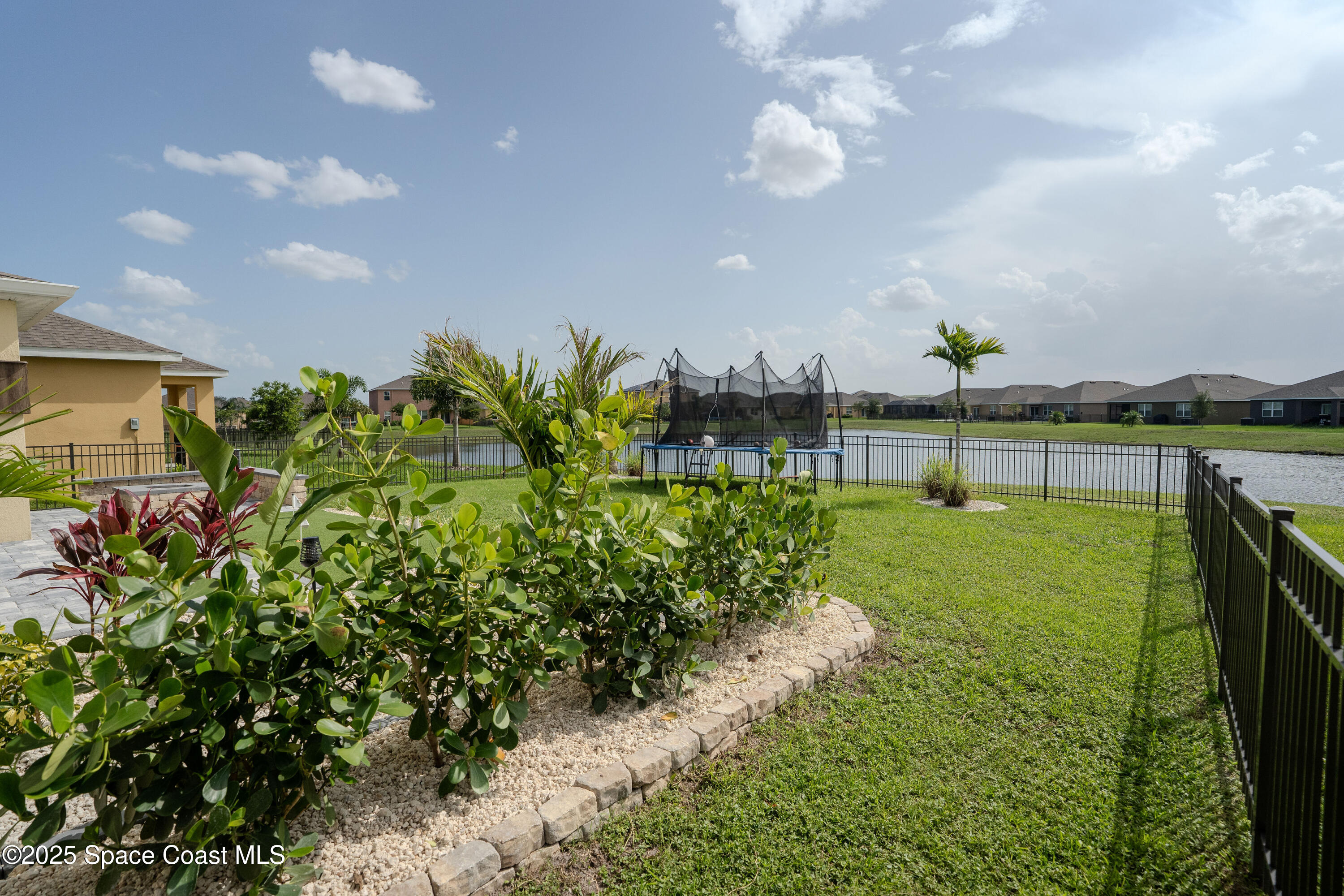 3409 Burrowing Owl Mims, FL 32754 - Photo 30 of 36 a view of a garden