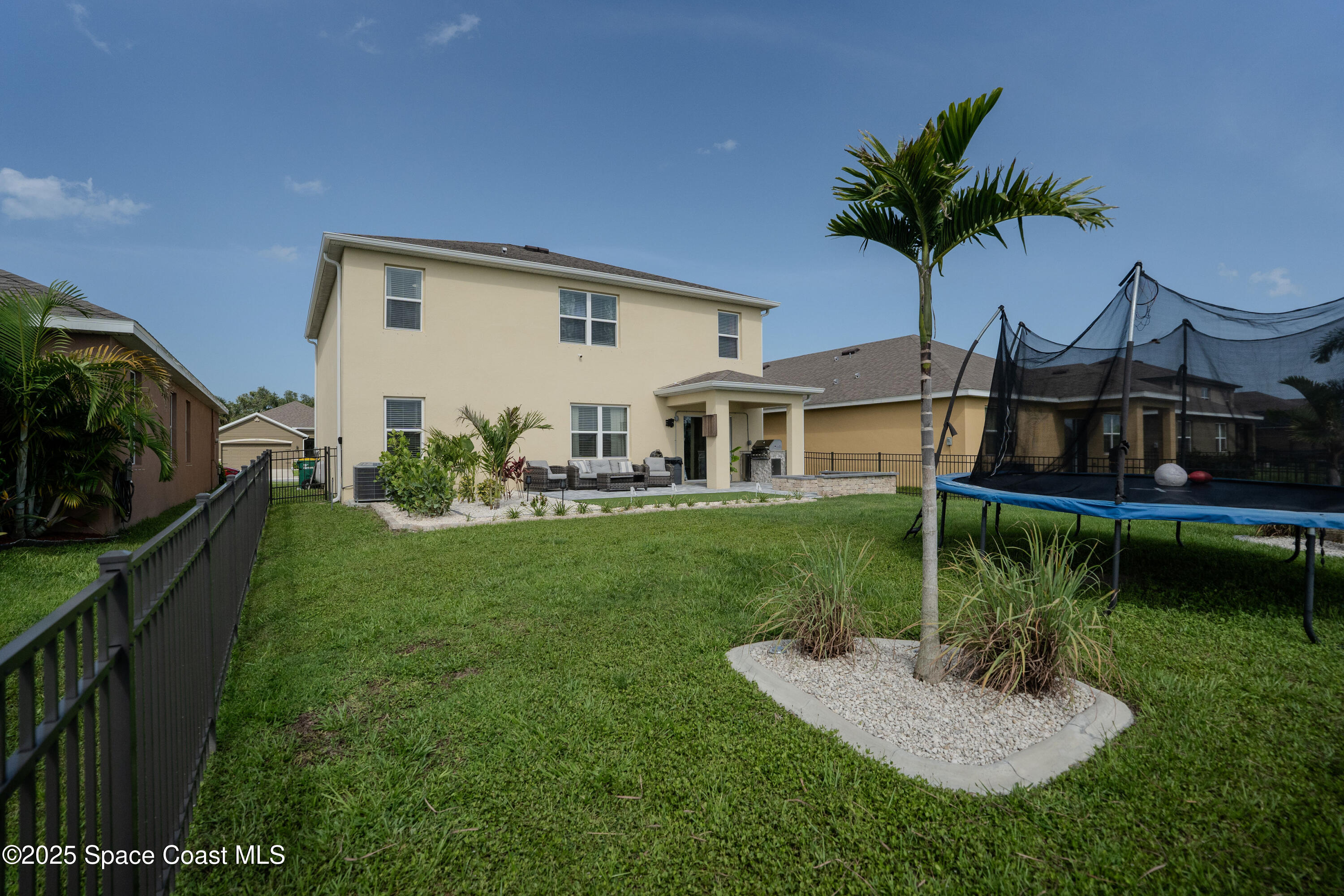 3409 Burrowing Owl Mims, FL 32754 - Photo 31 of 36 a front view of a house with garden