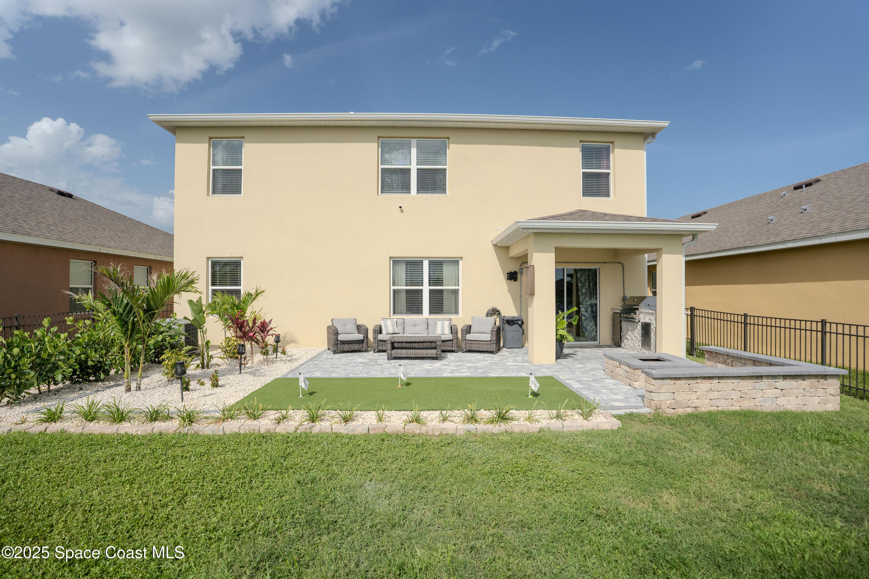 3409 Burrowing Owl Mims, FL 32754 - Photo 33 of 36 a front view of a house with a yard