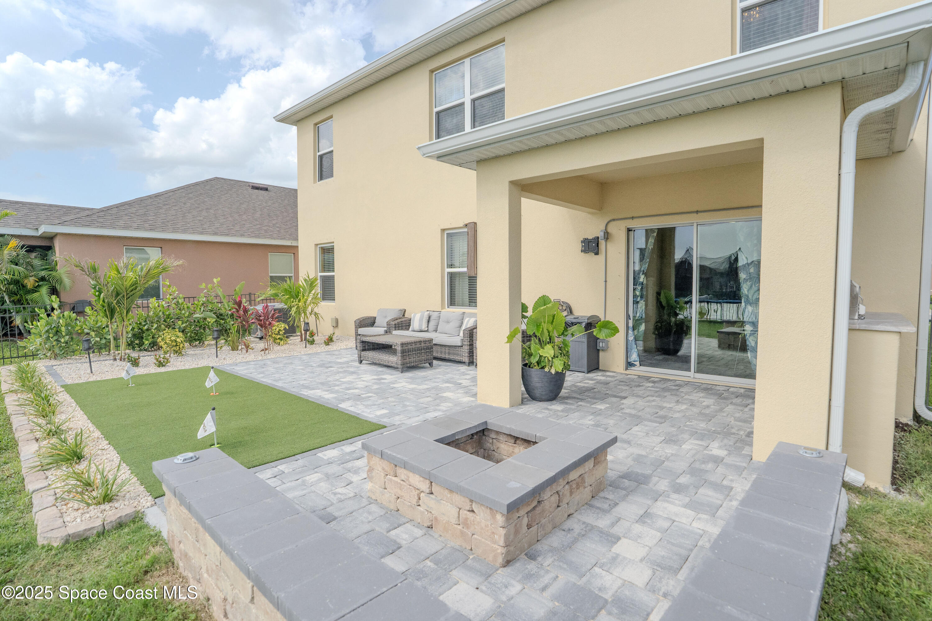 3409 Burrowing Owl Mims, FL 32754 - Photo 35 of 36 a view of a house with pool table and chairs